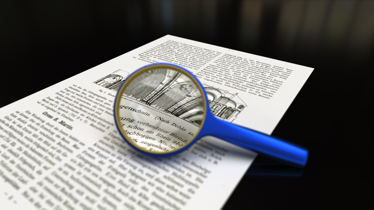 Magnifying_glass_with_focus_on_paper.png